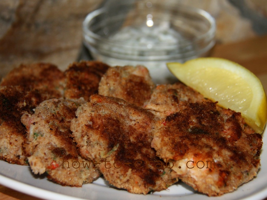 A plate of bready crab cakes with mild spice.
