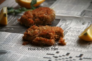 Simple and delicious fried crab cakes on newspaper